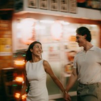 couple walking through tokyo backstreet alley with izakaya at night - travel stock pictures, royalty-free photos & images
