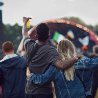 couple watching concert & holding beers, rear view - concert stock pictures, royalty-free photos & images
