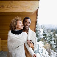 couple wearing a blanket - home decoration stock pictures, royalty-free photos & images