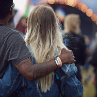 couple with arms around each other at concert - concert stock pictures, royalty-free photos & images