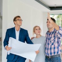 couple with real estate agent visiting property for viewing - home decoration stock pictures, royalty-free photos & images