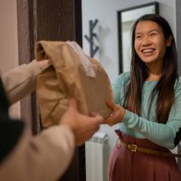 courier delivering fast food to the customer - junk food stock pictures, royalty-free photos & images