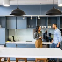 coworkers talking in the cafeteria while taking a break at the office - coffee stock pictures, royalty-free photos & images