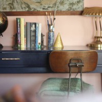 cozy, pink bedroom with blue desk, antique factory chair, brass lamp and thrifted wool blankets. - home decoration stock pictures, royalty-free photos & images