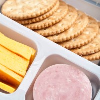 crackers, sliced cheese and ham in a plastic tray - junk food stock pictures, royalty-free photos & images