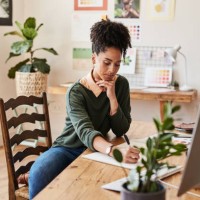 creative business woman planning on paper, designer writing on blueprint and thinking of ideas for fashion clothing in a modern work office. business owner or stylist working on drawing of clothes - fashion stock pictures, ro