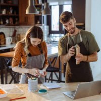 creative young couple watching online tutorial about woodcraft - home decoration stock pictures, royalty-free photos & images
