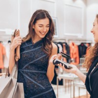 credit card contactless payment in a luxury store - fashion stock pictures, royalty-free photos & images