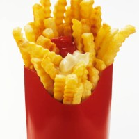 crinkle cut french fries in red box with ketchup and mayonnaise - junk food stock pictures, royalty-free photos & images