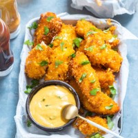 crispy baked cod fish nuggets with crisps on side. - junk food stock pictures, royalty-free photos & images