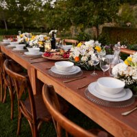 crockery arranged with flowers on table for dinner - garden decoration stock pictures, royalty-free photos & images
