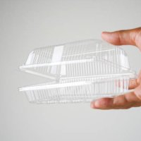 cropped hand holding plastic food container - junk food stock pictures, royalty-free photos & images
