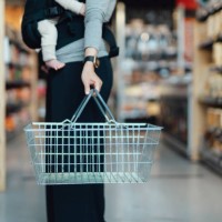 cropped shot of mother carrying a shopping cart, doing grocery shopping in supermarket - food fotografías e imágenes de stock