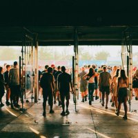 crowd of people entering music festival - concert stock pictures, royalty-free photos & images