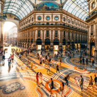 crowd of people in galleria vittorio emanuele ii at sunset, milan, italy - travel stock pictures, royalty-free photos & images