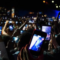 crowd of people recording video with cell phones at night - concert stock pictures, royalty-free photos & images