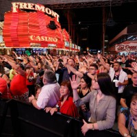 Crowd reacts as they watch musical act Zowie Bowie in concert during a