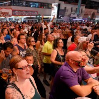 Crowd watches musical act Zowie Bowie in concert during a 