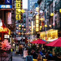 crowded illuminated street with restaurants in bars in chinatown, new york city, usa - food stock pictures, royalty-free photos & images