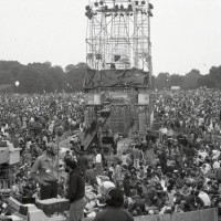 Crowds react as they listen to Paul Simon and Art Garfunkel perform on stage at the Great Lawn in Central Park in Manhattan on September 19, 1981. It...