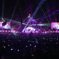 Crowds wear illuminated wristbands as they listen to Coldplay perform on the Pyramid Stage on the fourth day of the Glastonbury festival at Worthy...