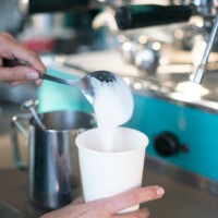 cu woman making a latte - junk food stock pictures, royalty-free photos & images