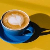 cuo of cappuccino on yellow table - coffee stock pictures, royalty-free photos & images