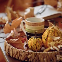 cup of coffee on wooden table with pumpkins, books and dried leaves outdoor - home decoration stock pictures, royalty-free photos & images