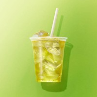 cup of green tea on green background - junk food stock pictures, royalty-free photos & images