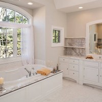 custom white toned master bathroom with hot tub tub. - fashion stock pictures, royalty-free photos & images