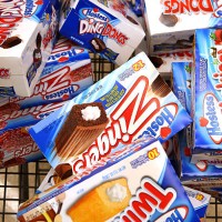 Customer heads to the checkout with a shopping cart loaded with Hostess snacks at a Jewel-Osco grocery store on December 11, 2012 in Chicago,...