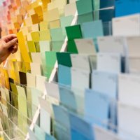 customer holding a color sample at a home improvement store - home decoration stock pictures, royalty-free photos & images