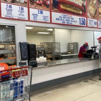 Customer ordering food at Costco, Florida.