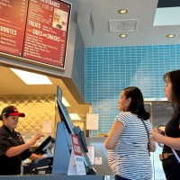 Customer places in order at The Habit Burger Grill on April 11, 2024 in San Rafael, California.