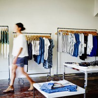 customer with shopping bag walking in boutique - fashion stock pictures, royalty-free photos & images