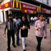 Customers leaving India's first McDonald's, which opened in 1996, in the Visant Vihar, upper/middle class area. For religious reasons, no beef...