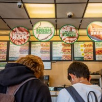 Customers order food at a Subway fast-food restaurant on April 29, 2022 in Houston, Texas. The fast-food chain closed over 1,000 stores last year and...