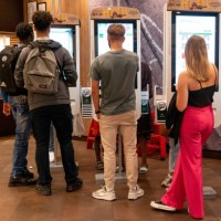 Customers place orders at self-service screens in a McDonald's Corp. Fast food outlet in Strasbourg, France, on Wednesday, Sept. 14, 2022. French...