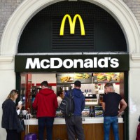 Customers purchase lunch at a McDonald's fast food restaurant located in London Victoria train and underground station in London, England.