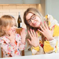 cute 3 year and her cool auntie showing off their newly nails. - nails art stock pictures, royalty-free photos & images