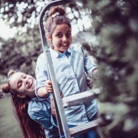 cute female children having fun with ladder in home backyard - garden decoration stock pictures, royalty-free photos & images