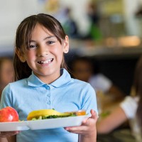cute hispanic girl in private school cafeteria lunchroom - food stock pictures, royalty-free photos & images