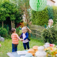 cute kids having fun outside for summer backyard party - garden decoration stock pictures, royalty-free photos & images