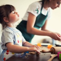 cute little girl baking at home with mom - food stock pictures, royalty-free photos & images