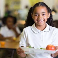 cute little girl in school cafeteria with food tray - food stock pictures, royalty-free photos & images