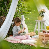 cute little girl on easter egg hunt in blooming spring garden - garden decoration stock pictures, royalty-free photos & images