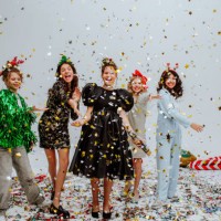 cute teen girls with hairdressers posing in studio with confetti and balloons. - fashion stock pictures, royalty-free photos & images