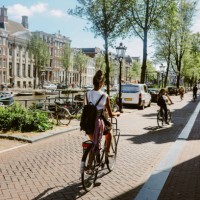 cycling commute in amsterdam, the netherlands - travel stock pictures, royalty-free photos & images
