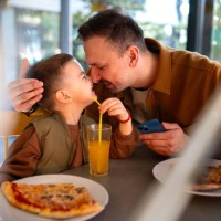 dad and soon eating pizza - junk food stock pictures, royalty-free photos & images