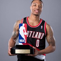 Damian Lillard of the Portland Trail Blazers poses with the Eddie Gottlieb Trophy after winning the 2012-2013 Kia NBA Rookie of the Year award on May...